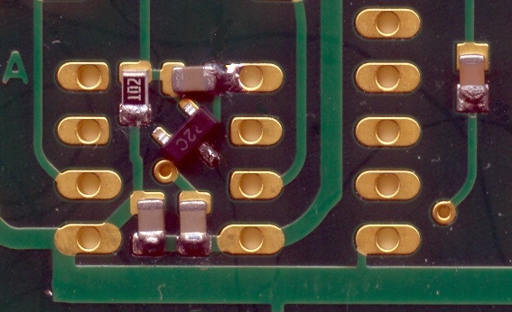 SMDs shoved into the solder blobs